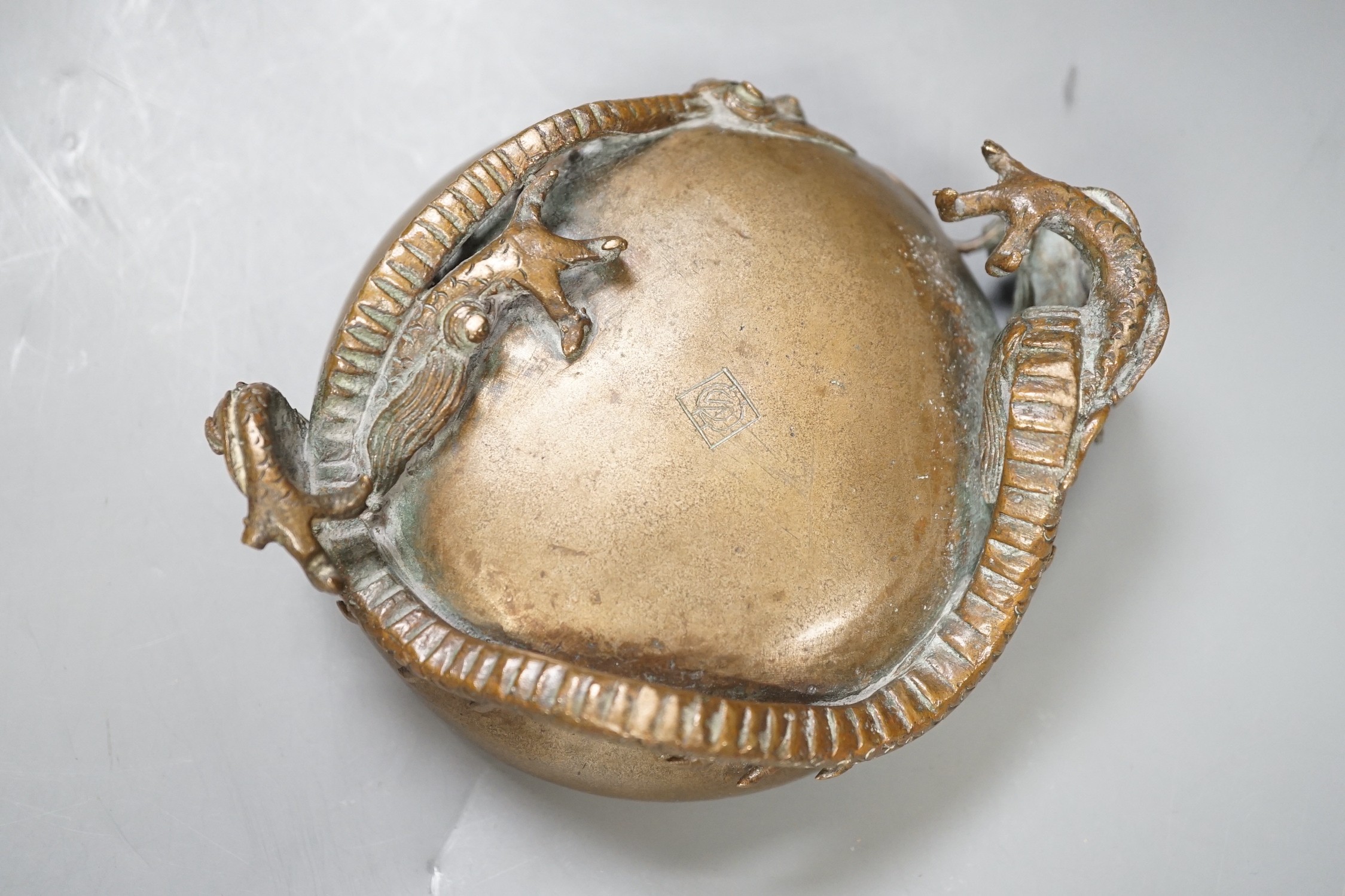 A Chinese or Japanese bronze ‘dragon’ dish, 13cm